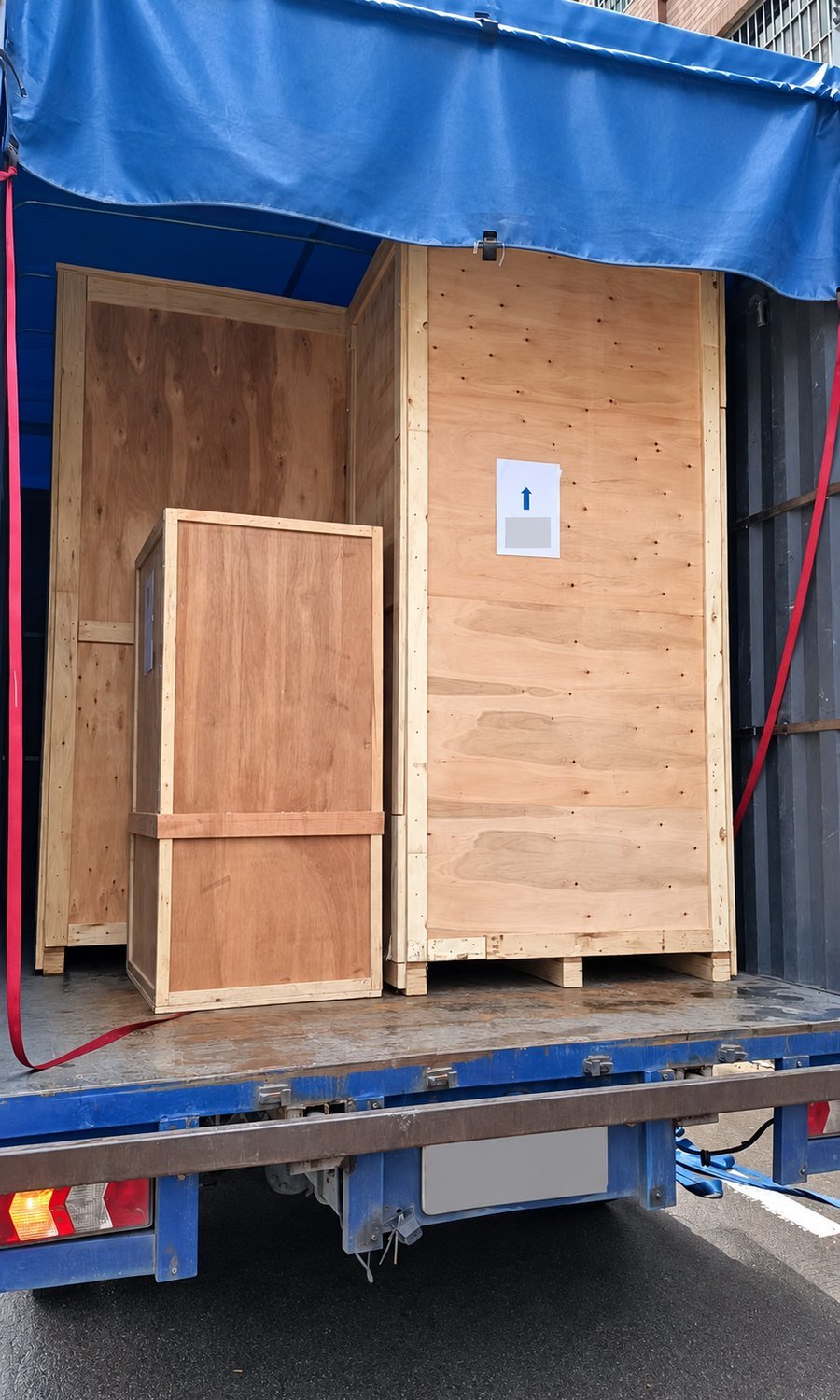 Factory photo · Crated booths loaded for shipment